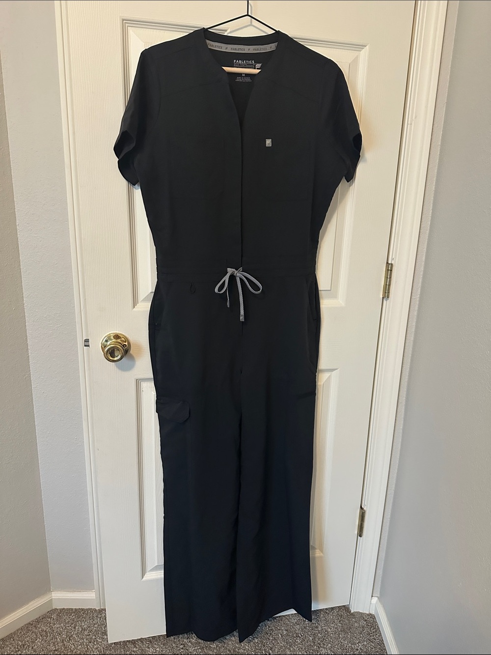 Fabletics Black Utility Scrub Jumpsuit with Gray Drawstring - Picture 2 of 11